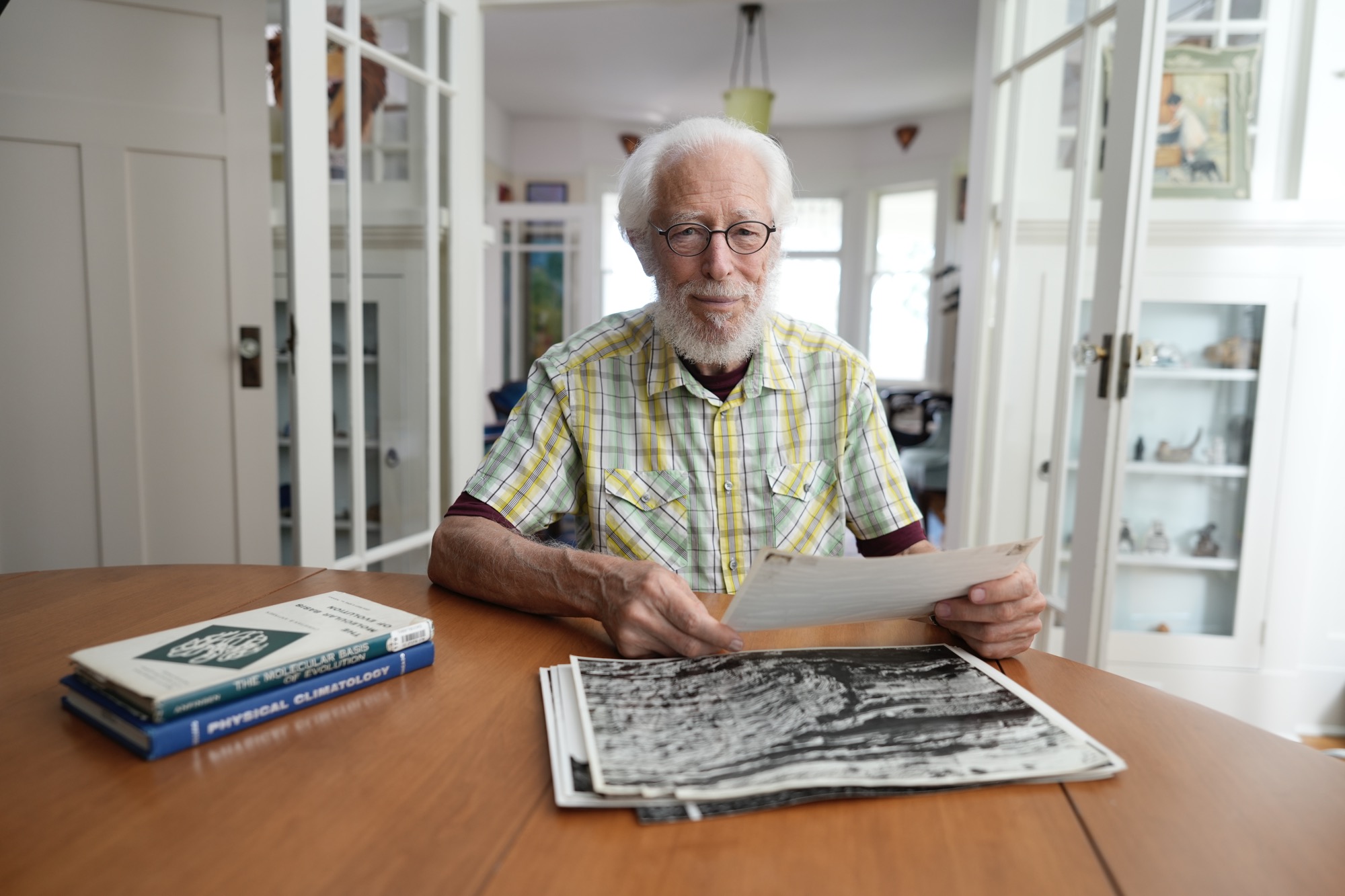 Paul F Hoffman sitting at his desk